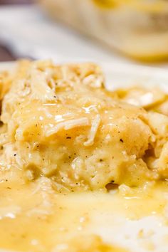 a close up of food on a plate with gravy