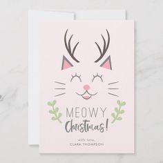 a christmas card with a cat's face and the words meowy christmas