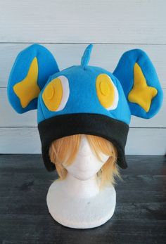 Shinx Pokemon Fleece Hat Themed Winter Costume Hat, Adjustable Fun Costume Hats And Headpieces For Cosplay, Fun Adjustable Costume Hats And Headpieces For Cosplay, Fun Beanie Costume Hats And Headpieces, Playful Adjustable Costume Hats For Cosplay, Themed Costume Hat For Cosplay, Adjustable Felt Costume Hats And Headpieces For Winter, Themed Costume Hats And Headpieces For Winter, Themed Costume Hats And Headpieces For Cosplay