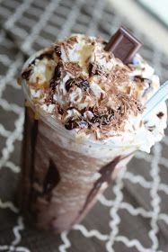 a cup filled with chocolate and whipped cream