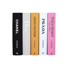 four books are lined up next to each other on a white surface with black lettering