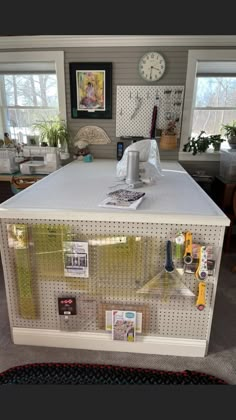 a kitchen island with lots of magnets on the front and back sides, in a home office