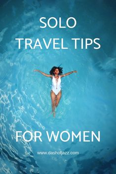 a woman floating in the water with her arms spread out and text solo travel tips for women