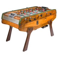 an old fashioned foosball table is shown on a white background with clippings