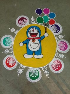 a colorful drawing on the ground with balloons