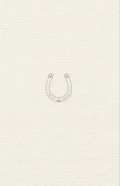 a drawing of a horseshoe on the side of a white paper with an outline of a horse's head