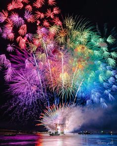 colorful fireworks are lit up in the night sky