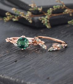 a close up of a ring on a wooden surface with flowers and leaves around it