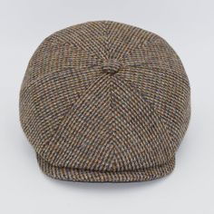 a brown and blue plaid hat on a white background