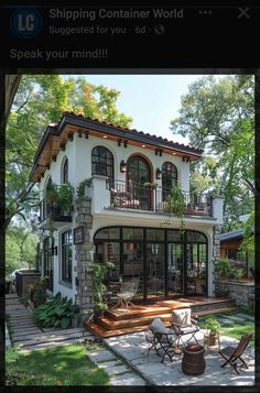 an image of a house that is in the middle of some grass and plants on it