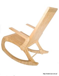 a wooden rocking chair sitting on top of a white floor