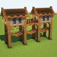 two wooden structures with lights on them