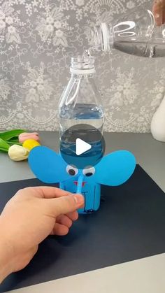 someone is making a paper elephant out of water