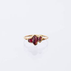 Pairs well with matching Earrings and Pendant! A minimal garnet ring with a comfortable dainty ring shank. Stacks well with other rings, particularly colored gemstone rings. This garnet is completely natural, raw, and uncut. Although Garnets are the birthstone for January, these gems are super trendy and can be worn by and gifted to just about anybody! -Three Genuine Rough Garnet, Uncut -Gem size – 3-5mm each -Pure 14k gold fill Shank -24k Gold Dipped Please read our FAQ for more information on Raw Stone Ring, Ringe Gold, Gold Dipped, Raw Stone, Dainty Ring, Gemstone Colors, Matching Earrings, Stone Rings