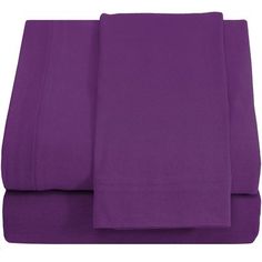 the purple sheets are folded on top of each other