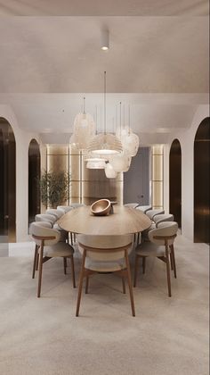 a dining room table surrounded by chairs and chandelier in the middle of an open floor plan