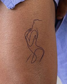 a person with a tattoo on their leg