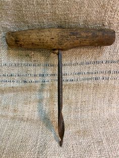 an old wooden handle on the back of a couch