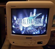 an old computer monitor with the final fantasy title on it's screen and keyboard