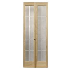 an unfinished wooden door with frosted glass panels on the front and side paneling