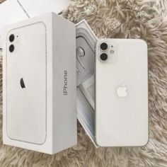 two new iphones are in the box, one is white and the other is silver