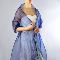 A very elegant organza shawl for your wedding party or evening dress. Made of luxury organza, slightly sparkles on the sun or light. Color: royal blue ( other colors are available ) Size : 200 cm x 45 cm You can use it as a wrap, shawl or stola. WE have matching bags in our Etsy Shop! WE accept credit cards! Elegant Blue Shawl For Parties, Elegant Blue Shawl For Spring, Elegant Blue Shawl For Summer, Shawls And Wraps Formal Blue, Elegant Sheer Shawl For Wedding, Elegant Blue Shawl For Evening, Elegant Sheer Veil For Evening, Elegant Sheer Wedding Shawl, Elegant Blue Shawl