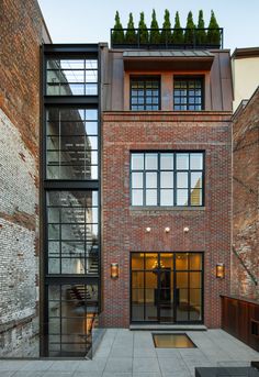 a brick building with lots of windows and stairs