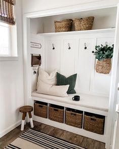 a white bench with baskets on it