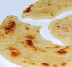 two pieces of bread on a white plate