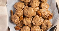 a plate full of pecan covered donuts and pecans