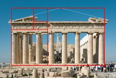 people are standing in front of an ancient building with red squares on it's sides