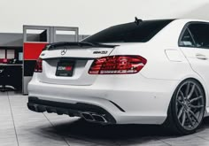 the rear end of a white mercedes c - class