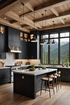 a kitchen with wooden floors and black cabinets, an island countertop and stools