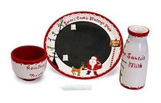 a christmas dinner set with santa clause on the plate and red trimming around it