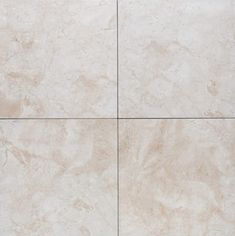 a white tile floor with four squares in the middle and one square at the top