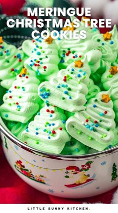 green christmas tree cookies in a bowl with the title overlay reading, merry meringue christmas tree cookies