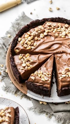 there is a chocolate pie with nuts on top