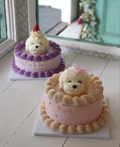 two cakes decorated with teddy bears on top of each other, one pink and the other purple