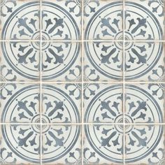 a blue and white tile pattern with an ornate design in the center, on top of a