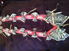 a necklace made out of money and coca cola cans