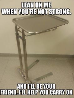 a metal table sitting on top of a white floor