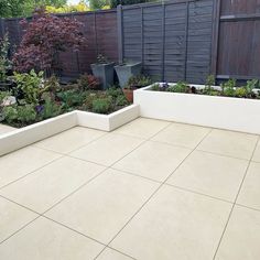 an outdoor patio with several planters in it