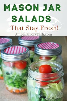 mason jar salads with tomatoes and lettuce in them