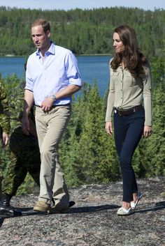 prince william and kate are walking near the water