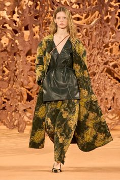 Featured in Look 34 of our Autumn/Winter 2024 runway show, our Nimes Pant creates a compelling visual language with paisley motifs that are uniquely swirled and layered across silk crepe de chine. Lightly quilted, this green and yellow style features a high waist, is gently slouched, and has an elegantly tapered silhouette. Coordinate with our matching Vedra Blouse. Composition: 100% Silk Pair with our Vedra Blouse and Carved Heart Earrings to complete the look. Explore more from our Baroque Cre 2024 Runway, Nyc Boutiques, Autumn Winter 2024, Knitted Coat, Knit Sweatshirt, Signature Print, Runway Show, Silk Crepe, Winter 2024