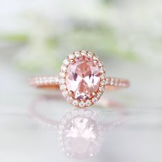 Beautiful Classic Morganite Halo Ring ►Base Metal: Sterling Silver (S925) ►Plating: 14K Rose Gold Vermeil ►Accented With Simulated Diamonds Main Stone: Morganite Stone Creation: Lab-Created Color: Peachy-Pink Stone Cut: Oval Gem size: 8.0 x 6.0 mm Carat Weight: 1.21 ct. Stone Origin: Russia ►Please be aware that plated jewelry can wear off over time, if this is a concern we would suggest going with the sterling silver or solid gold jewelry option. ►Solid gold morganite ring can be purchased at: Classic Morganite Diamond Ring For Wedding, Classic Morganite Diamond Wedding Ring, Rose Gold Halo Setting Ring As A Gift, Rose Gold Halo Setting Wedding Ring As Gift, Rose Gold Halo Setting Wedding Gift, Elegant Blush Rings For Promise, Elegant Blush Promise Ring, Elegant Blush Rings As A Gift, Fine Jewelry For Anniversary In Blush Color