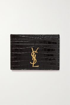 SAINT LAURENT's cardholder has a slim silhouette that's perfect for slipping into even the smallest clutches or bags. Made in Italy from croc-effect leather, it has four card slots and a center pocket and is embellished with the label's gold-tone 'YSL' plaque. Ysl Summer Bag, Ysl Cardholder, Black Wishlist, Leather Wallets, Card Holders, Wallets, Saint Laurent Card Holder, Ysl Card Holder, Ysl Wallet