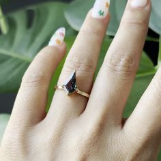 a woman's hand with a ring on it