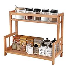 a wooden spice rack with jars and containers on it's sides, filled with spices