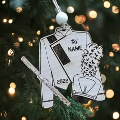 a personalized ornament hanging from a christmas tree